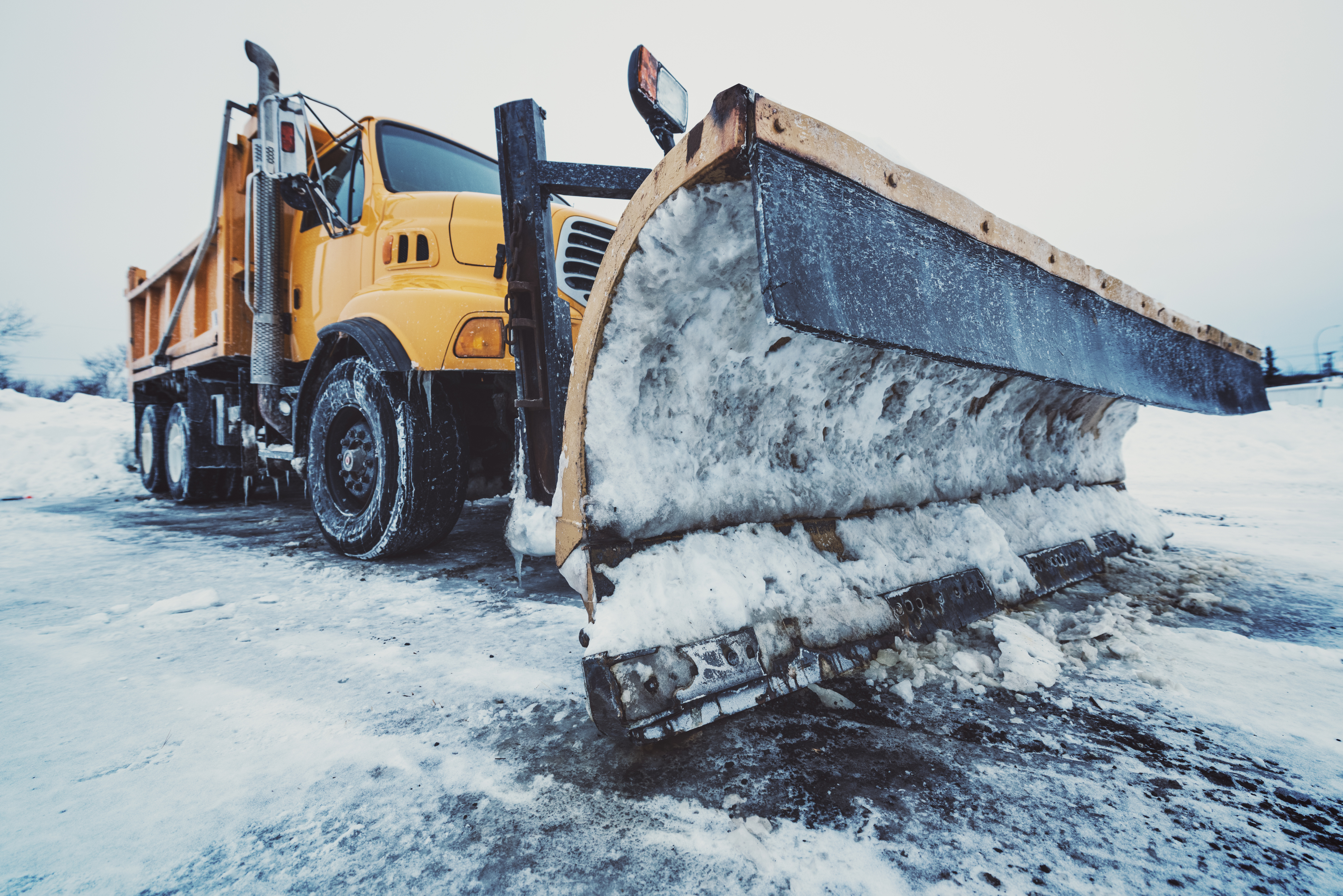 Tandem dump truck/snow plow ready for the next major snowfall.  Mild cross processing.